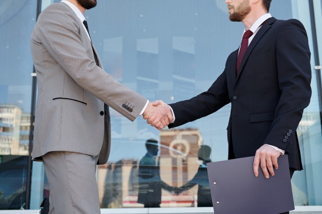 Men shaking hands outdoors